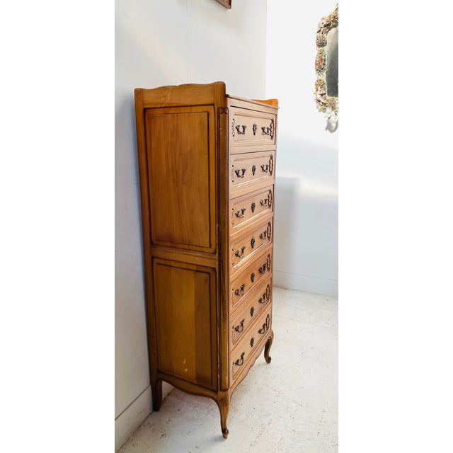 Regency-style cherrywood chest of drawers Rounded uprights and scrolled base Sides with two framed panels Good condition...