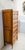 Regency-style cherrywood chest of drawers Rounded uprights and scrolled base Sides with two framed panels Good condition...