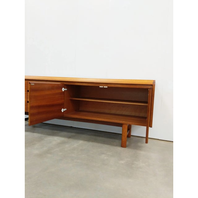 Authentic vintage mid century modern teak credenza / sideboard / console. By White and Newton. This piece is in excellent...