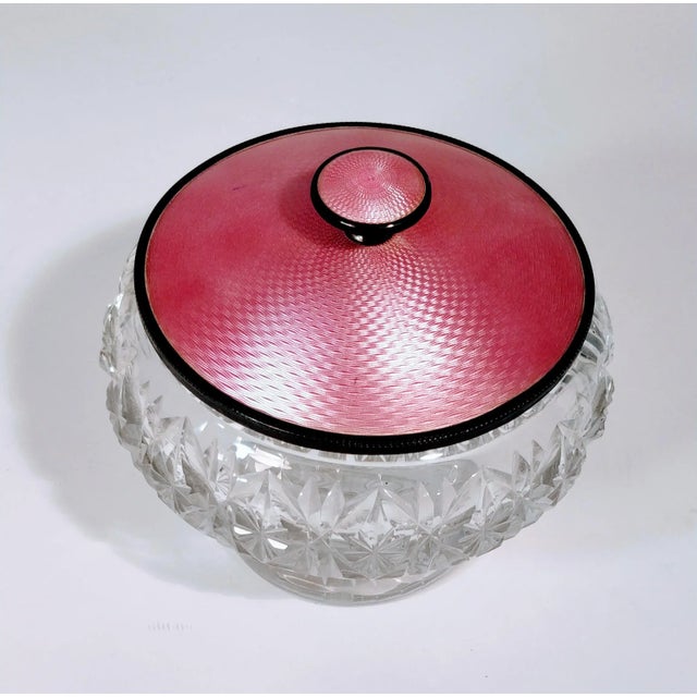 Vintage Fine English heavy cut crystal vanity jar with a pink guilloche enamel and sterling silver lid with mirror. This...