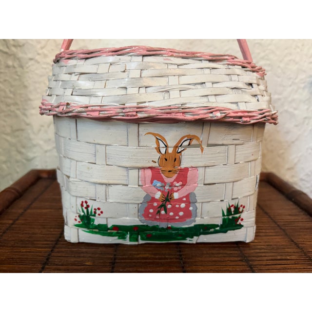 Charming Folk Art hand-painted white basket with pink trim. Features a girl bunny rabbit. Most items found at Pub & Oasis...