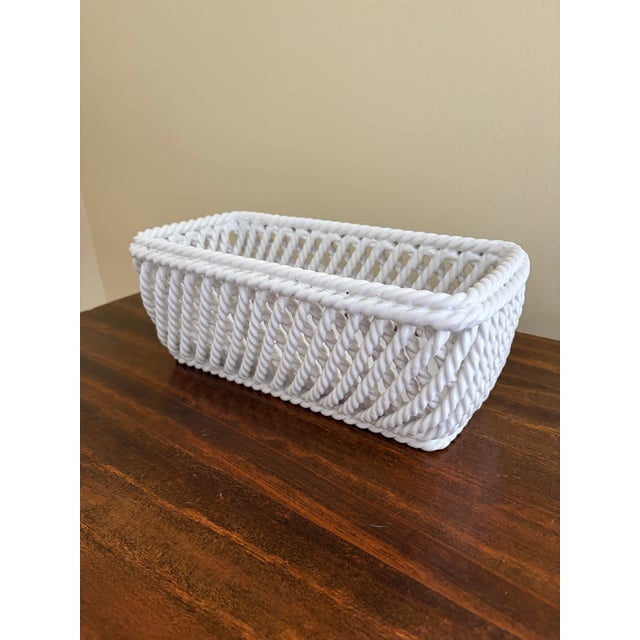 A gorgeous trompe l'oeil white French Country style reticulated porcelain woven rope basket cachepot Italy, Circa 1960s...
