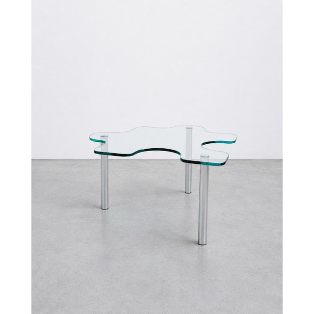 This 1980s Postmodern Puzzle Coffee/Side Table attributed to Alessandro Mendini is an elegant and playful addition to any...