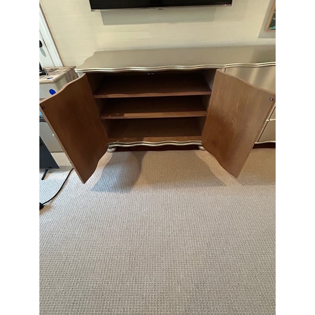 Superbly glamorous silver metallic finish designer wavy front sideboard by Julian Chichester characterized by its...