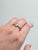 This handcrafted 14K yellow gold ring showcases a striking boulder opal, alive with natural color play. The asymmetrical...