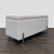 The bench has Plated iron legs in an Antique Brass finish. The seat lifts up via gas-lift mechanism to reveal storage...