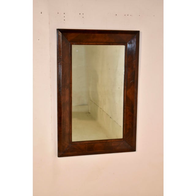 19th century walnut framed mirror from England. The frame is molded and has great depth and shape. The walnut used in the...
