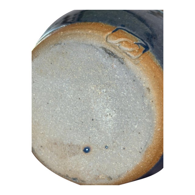 Hand-thrown studio art pottery vase. Features a beautifully layered teal, turquoise, and deep cobalt glaze over a charcoal...