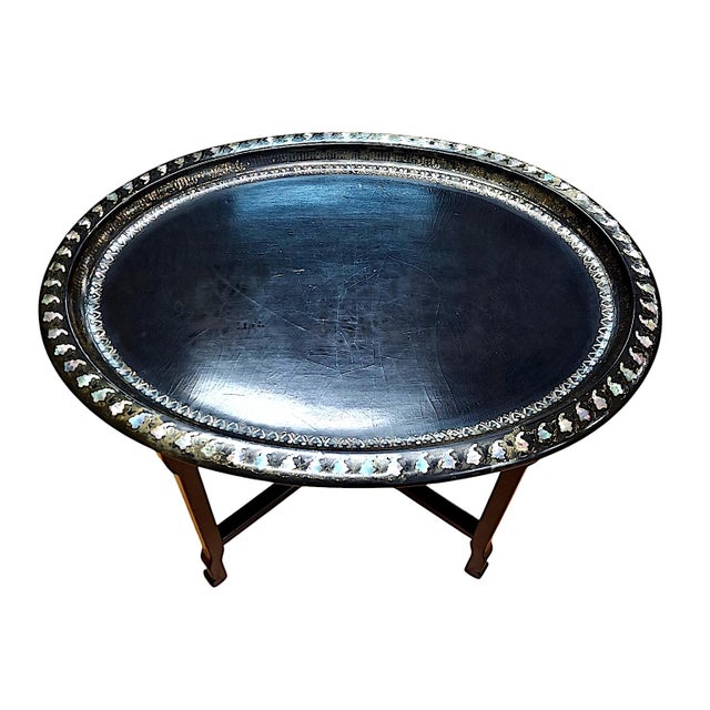 This oval tray table is a 19th-century decorative piece comprised of a tray and a separate custom-built stand. The tray is...