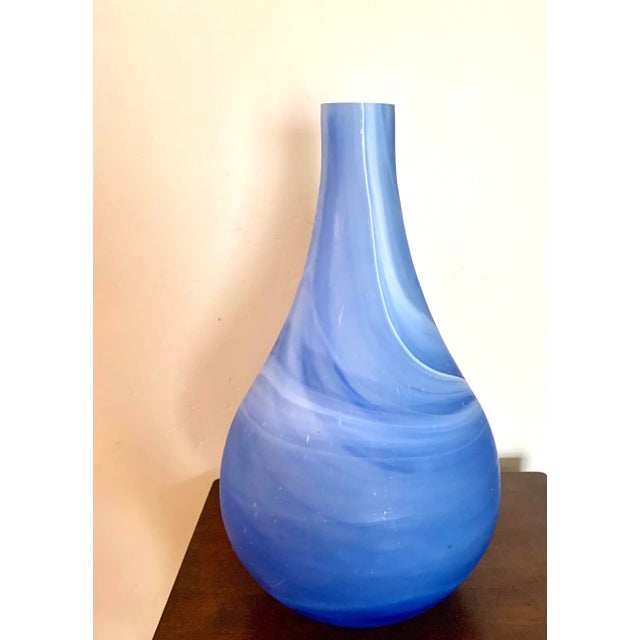 Add the color of the sky with this heavy glass modern minimalist vase to your decor Hues of soft white and blue Mouth...