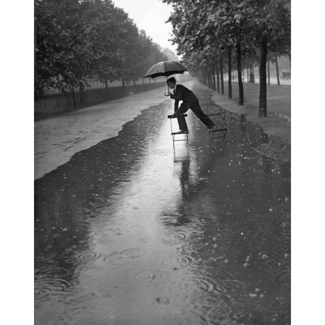 Flooded mall (1934) - silver gelatin fibre print (photo by h. F. Davis/getty images) a man crossing a stretch of...
