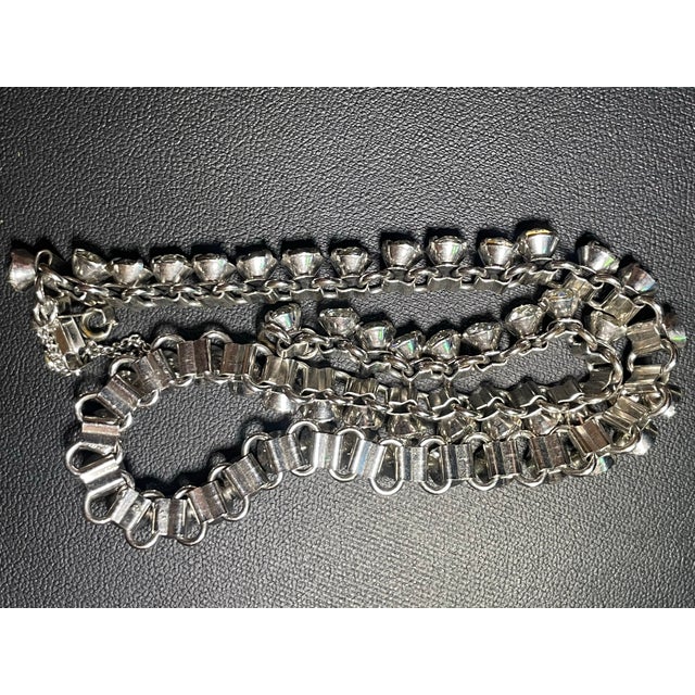 Kramer of New York classic styled Austrian crytal stone necklace featuring folded "bookend" cup chain construction. Kramer...