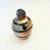 A vintage postmodern studio pottery container. Features a design of black, tan, and beige glazes around the sides. Nice...