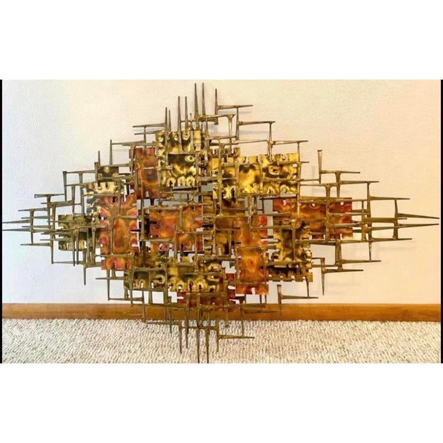 This Silas Seandel Midcentury Modern Brutalist Abstract Metal Wall Sculpture from the 1960s is a piece of amazing vintage...