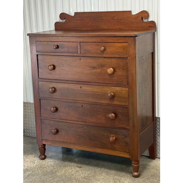 Beautiful 19th-century chest of drawers crafted in richly toned solid wood with wonderful age and character. This handsome...