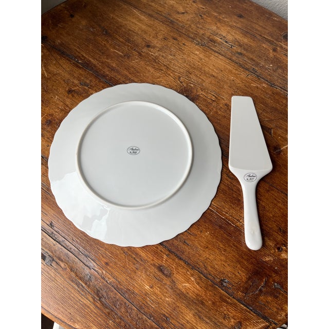 Andrea by Sadek Cake plate and Server set In White with Gold trim With box Plate is 10.5” diameter and 0.75” height Server...