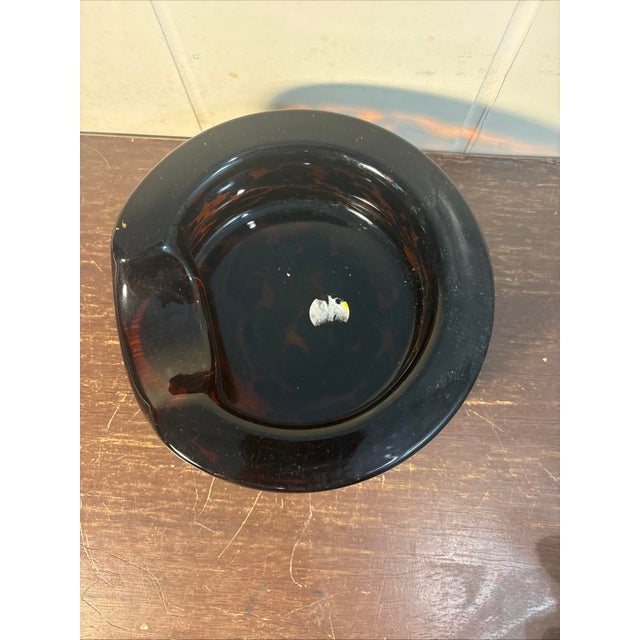 6” diameter 2.5” tall This vintage Murano blown glass pocket ashtray is handmade in Italy, featuring a unique...