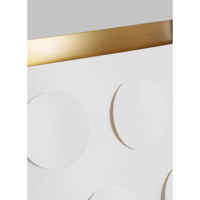 Dots are iconic to the kate spade brand—a simple and playful graphic motif. Dottie takes an iconic kate spade dot motif...