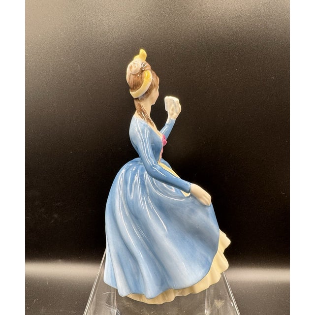 Celebrate the elegance of classic English craftsmanship with this Vintage Royal Doulton **"Leading Lady"** Figurine...