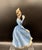 Celebrate the elegance of classic English craftsmanship with this Vintage Royal Doulton **"Leading Lady"** Figurine...