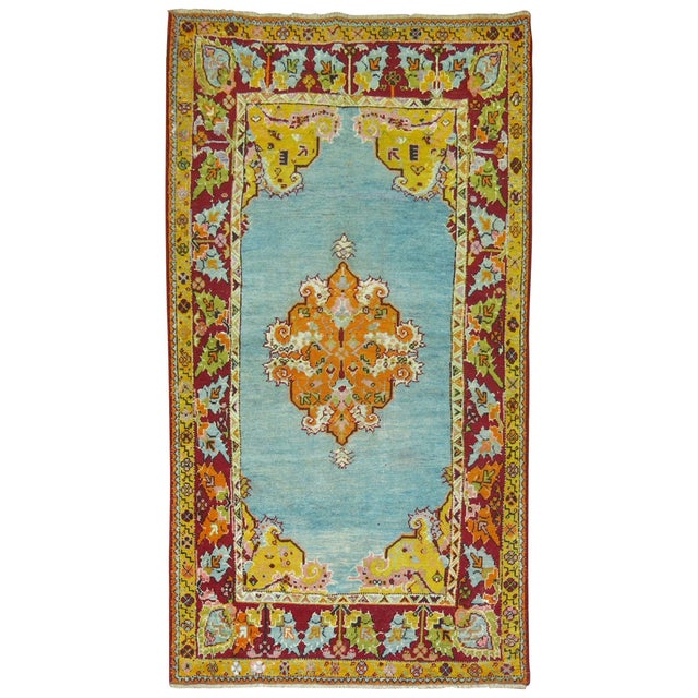 Superfluous antique Turkish Melas rug featuring a bright electric blue background. It was offered to us by a penthouse...