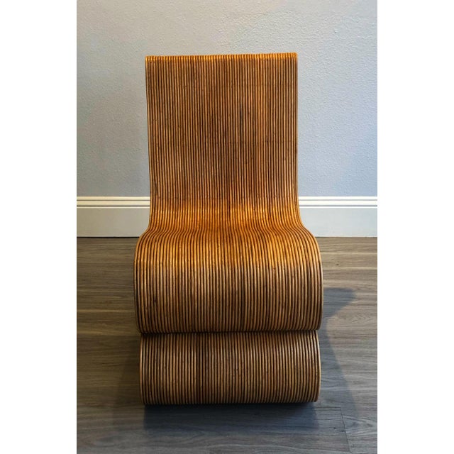 Handmade Rattan "Snake" Chair. Beautiful design, hand-crafted from all natural Indonesian rattan. Chair is perfect for...