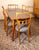 This beautiful dining set includes a maple and sycamore table with gray glass and six matching gray leather chairs. The...