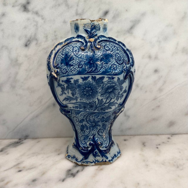 Antique Dutch Delft faience vase from the Netherlands, featuring a sculptural baluster form with elaborate hand-painted...