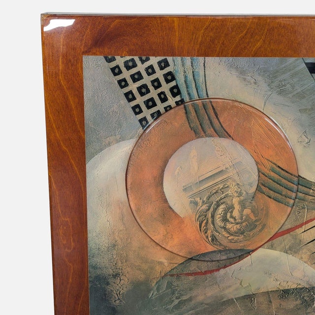This striking framed abstract artwork by Marlene Healey features a unique mix of shapes, textures, and muted colors. The...