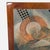 This striking framed abstract artwork by Marlene Healey features a unique mix of shapes, textures, and muted colors. The...