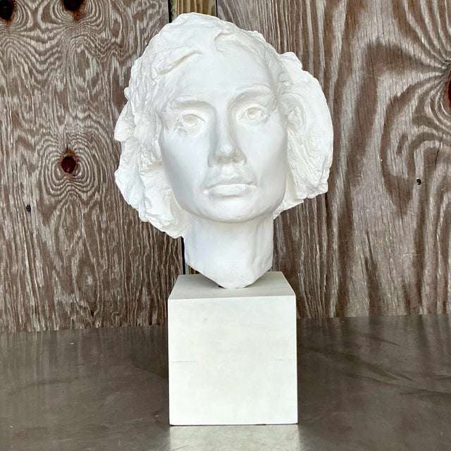This vintage boho plaster bust of a woman exudes timeless beauty with its delicate craftsmanship and serene expression....