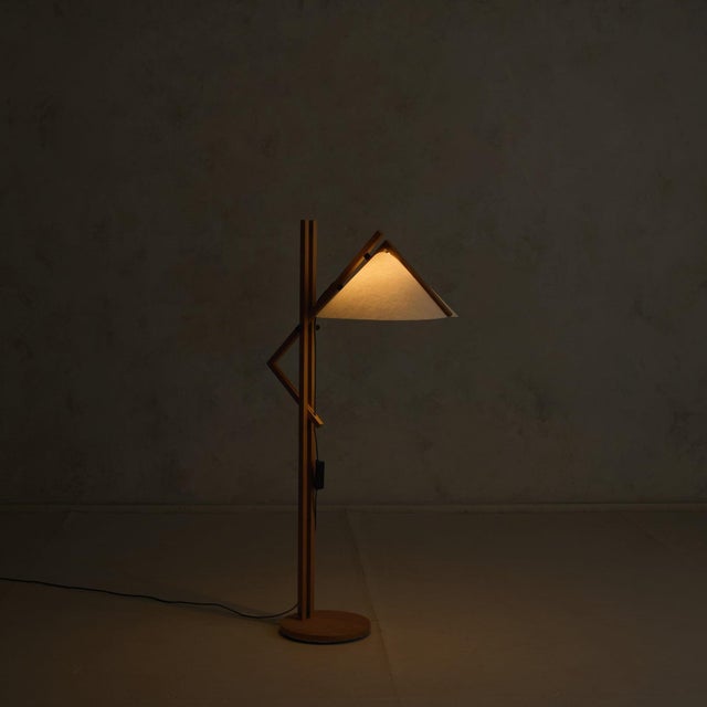 Rooted in the principles of Scandinavian Modern, a 1970s Danish floor lamp in beech, attributed to Domus, with its...