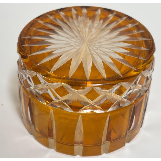 Bohemian Amber Cut-to-Clear Crystal Covered Box, Engraved Art Glass, circa 1920s–1940s. A refined example of Bohemian cut...