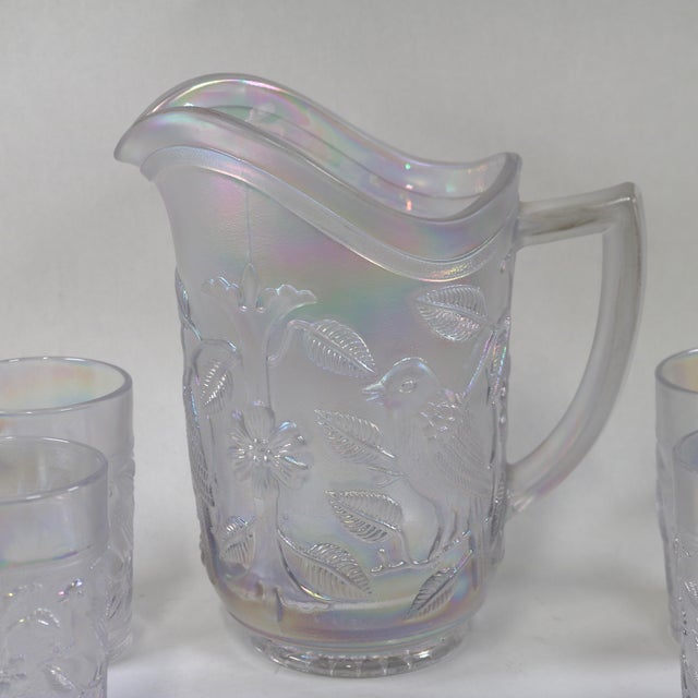 Gorgeous set by Imperial Glass out of Ohio. The frosty white opalescent glass has a carnival finish. Both the pitcher and...