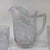 Gorgeous set by Imperial Glass out of Ohio. The frosty white opalescent glass has a carnival finish. Both the pitcher and...