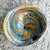 Enhance your decor with the Vintage Boho Italian Glass Swirl Bowl After Murano. This American-style piece showcases the...
