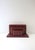 A French red‑burgundy leather letter holder with gold‑tooled trim, in the style of luxury maison Cartier, Classic /...