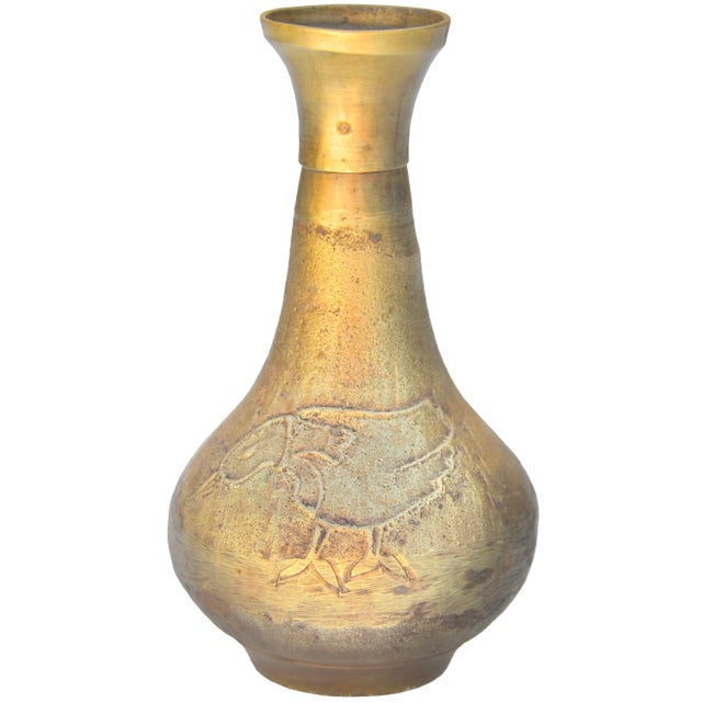 One-of-a-kind antique Moroccan solid brass vase artfully handcrafted offering a playful silhouette and featuring an...