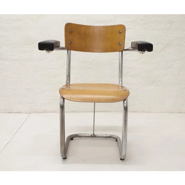 Industrial Leatherette and Wood Armchair from Gispen, 1950s, in Restored conditions. Designed 1950 to 1959 This piece is...