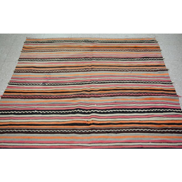 Vintage Turkish Anatolian hand woven kilim with natural colors and fine weave.