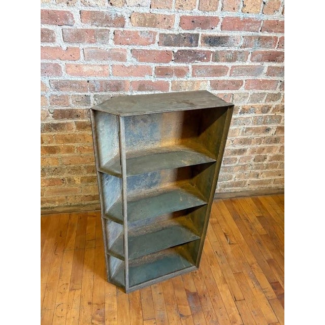 Authentic, heavy-duty vintage industrial metal shelving unit. Possible originally a wedge section from a factory shop...