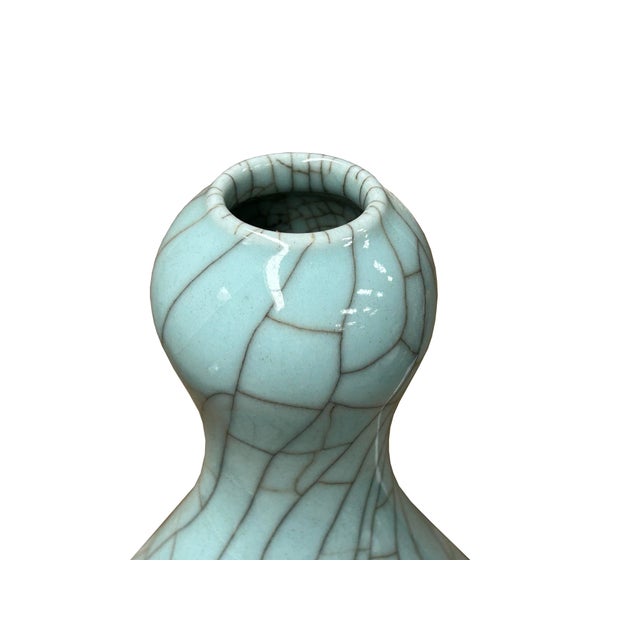 Immerse yourself in the captivating allure of this stunning celadon vase, a testament to classical artistry and refined...