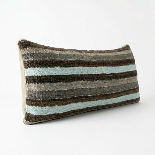 This beautiful 14'' x 39'' hand-woven Kilim pillow cover was made from an authentic Turkish kilim. The traditional flat-...