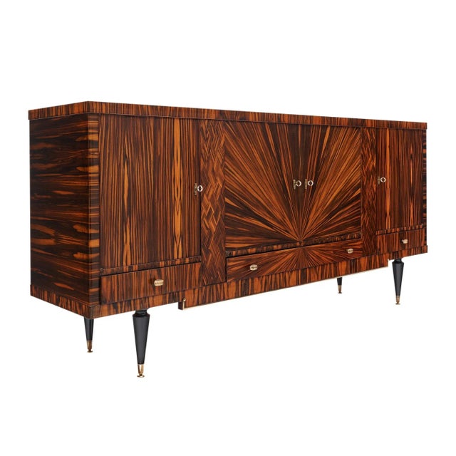 Buffet/Enfilade from the French Modernist period. The credenza boasts a spectacular sun pattern veneer on its facade as...