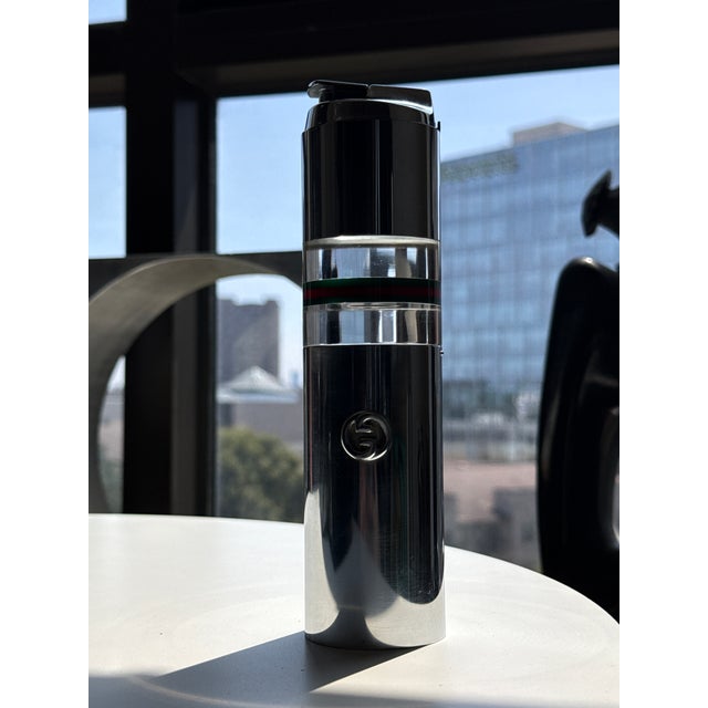 1970s Vintage Original Gucci table lighter. / box. This hard to find piece features polished chrome and acrylic with...