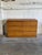 This six-drawer double dresser features a sleek profile on a solid plinth base. The streamlined form is accented by...