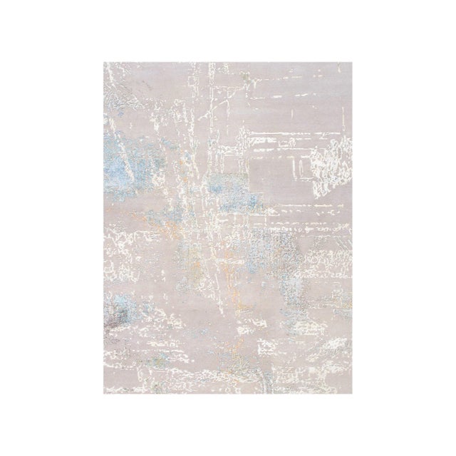 The Modern Collection explores hand-knotted designs through abstract patterning, solid tonal fields, and subtle surface...