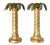 Offering a pair of vintage gold leaf metal palm tree candlesticks, circa 1970s. The candlesticks are made of a very heavy...