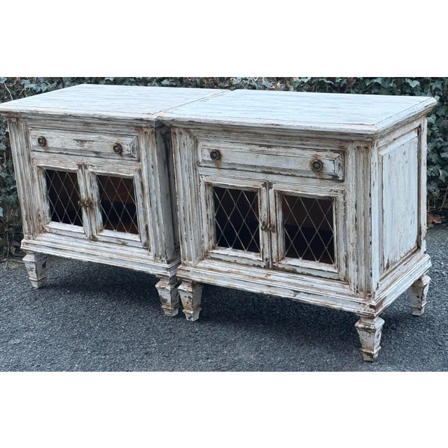 Charming pair of neoclassical nightstands fresh out of our studio. Reimagined in a rustic Gustavian finish these...