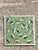 This vibrant vintage ceramic tile is a captivating example of mid-century decorative art, featuring a whimsical school of...